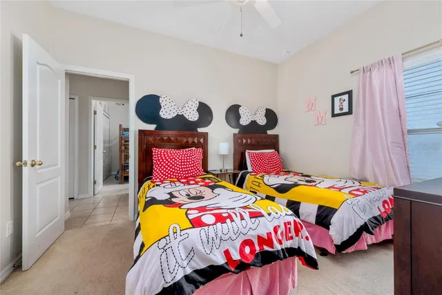 a room with pool table and windows