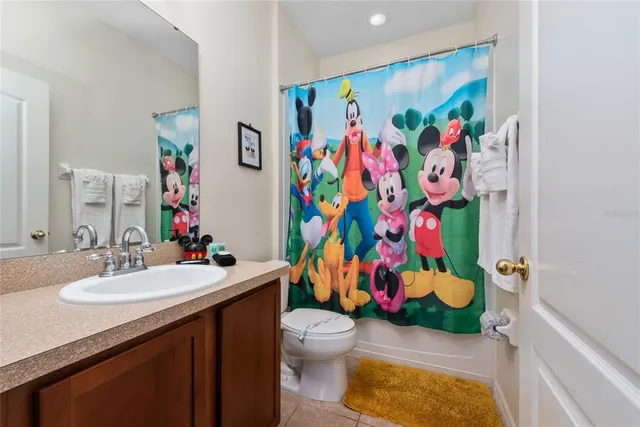 a large kitchen with a table and chairs