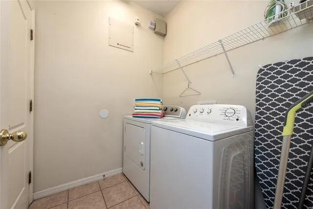 a large kitchen with a table and chairs