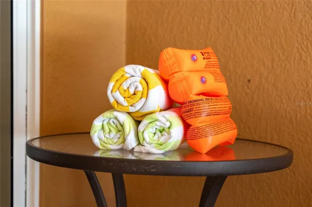 a bathroom with a sink toilet and shower curtain