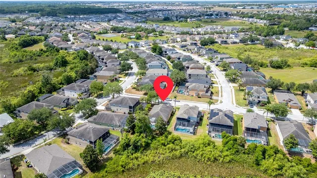 a kitchen with stainless steel appliances a stove a microwave and a refrigerator