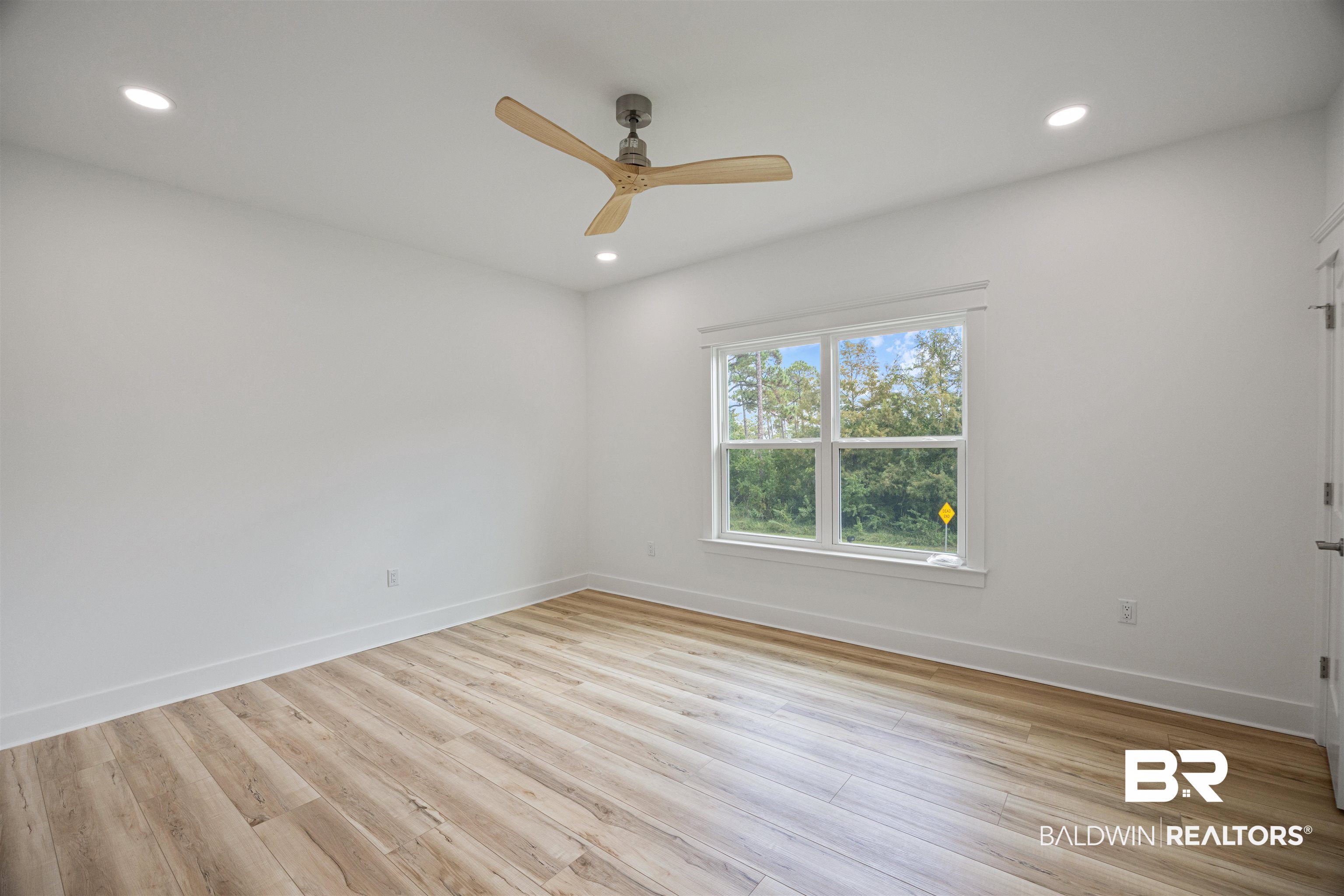 27591 Canal Road Orange Beach, AL 36561 - Photo 35 of 51 Spare room with light wood-style floors, recessed lighting, and ceiling fan