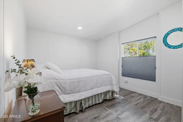 a bedroom with a bed and a dresser