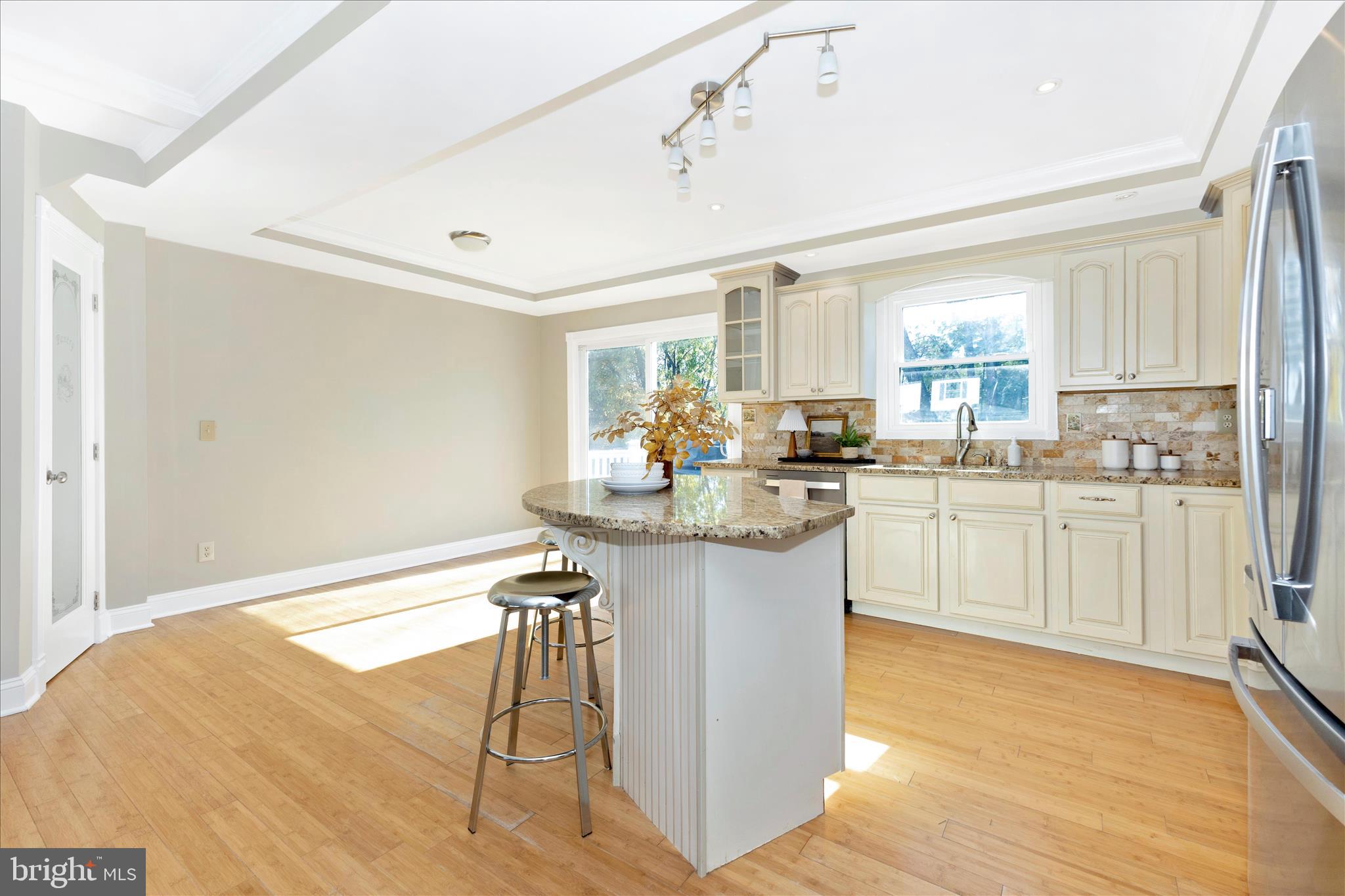 3919 Link Avenue Nottingham, MD 21236 - Photo 15 of 63 a kitchen with white cabinets and white appliances