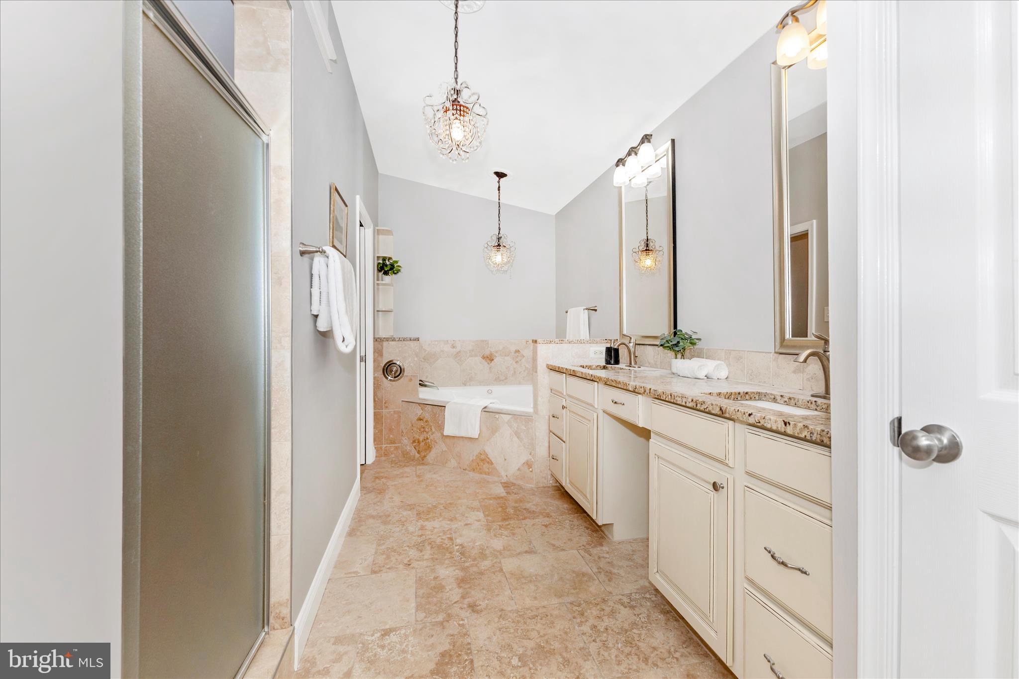 3919 Link Avenue Nottingham, MD 21236 - Photo 29 of 63 a bathroom with a granite countertop sink a mirror and a bathtub