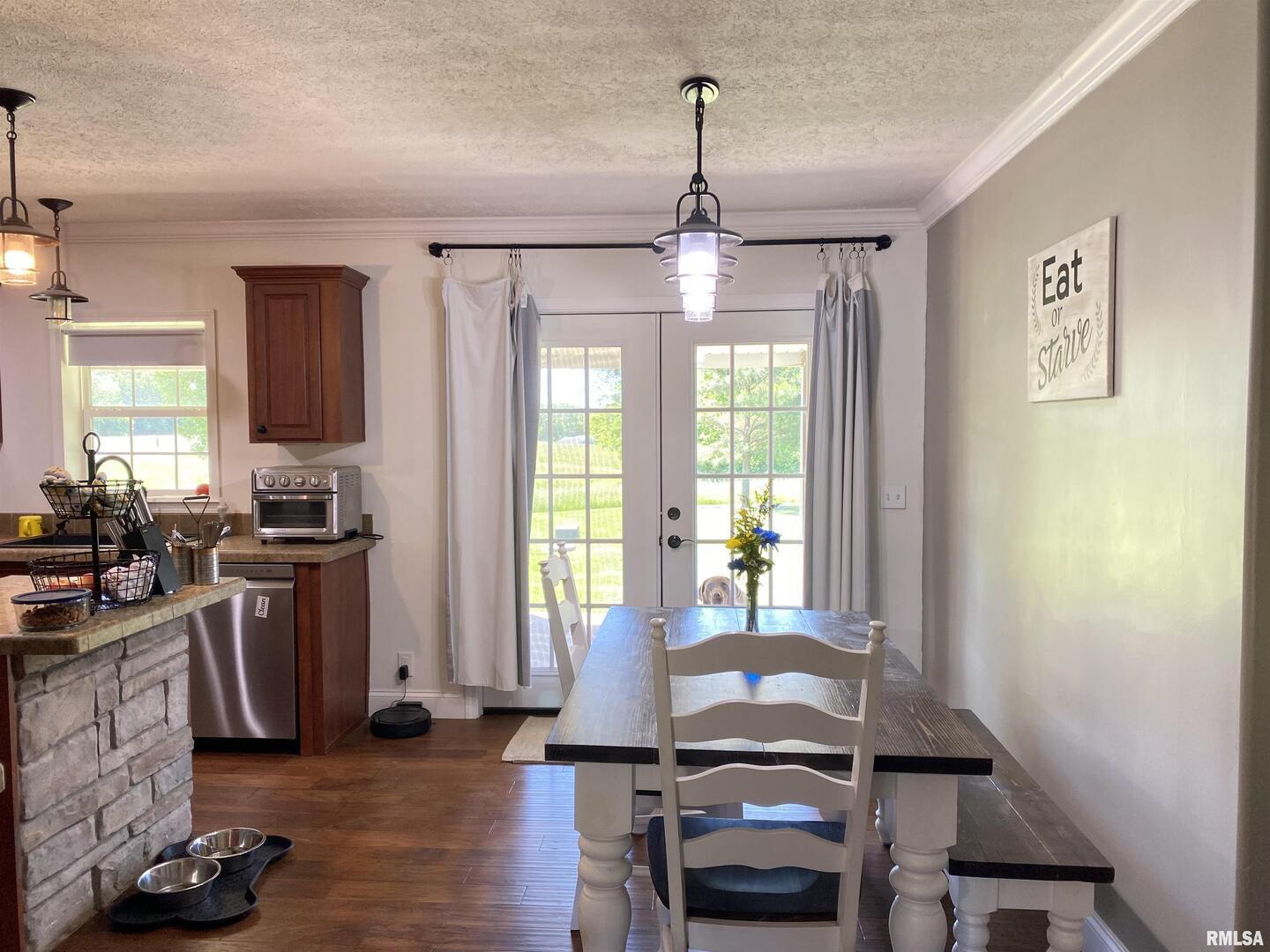 1640 Pleasant Ridge Road Vienna, IL 62995 - Photo 13 of 77 a view of a dining room with furniture window and wooden floor