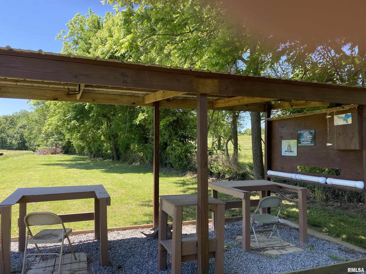1640 Pleasant Ridge Road Vienna, IL 62995 - Photo 27 of 77 a view of a chairs and table in patio