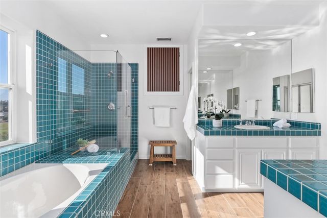 a view of a terrace with couches and sky view