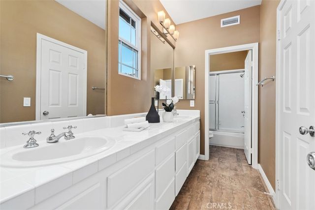 a view of a swimming pool with a table and chairs