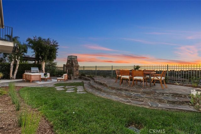 a view of outdoor space with garden and trees