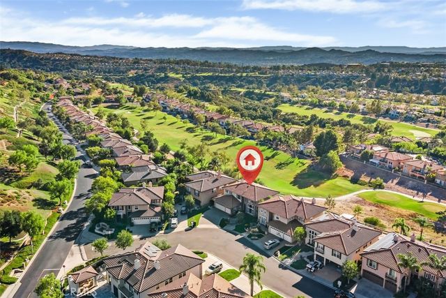 a dining room with furniture and chandelier