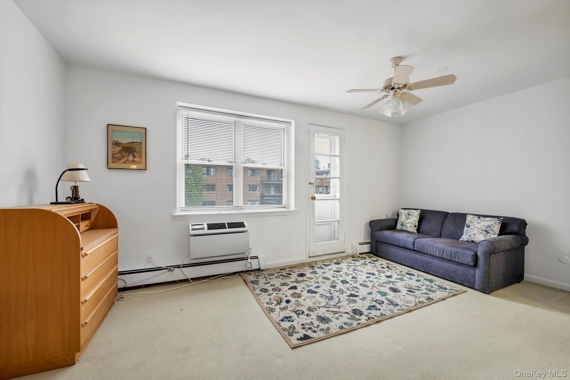 25 Chapel Place, Unit 3N Great Neck, NY 11021 - Photo 11 of 23 a bedroom with furniture and window