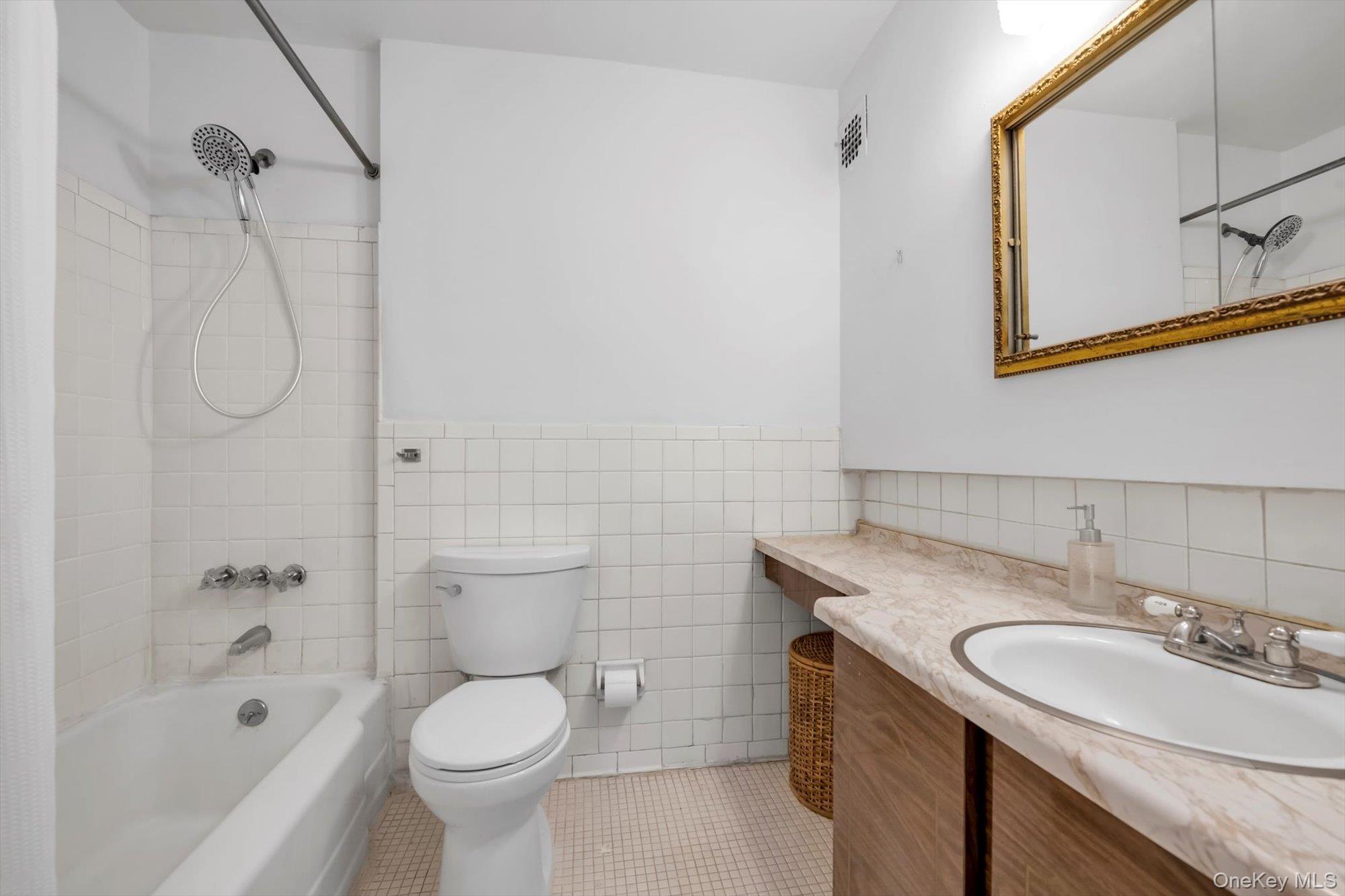 25 Chapel Place, Unit 3N Great Neck, NY 11021 - Photo 12 of 23 a bathroom with a granite countertop sink toilet and shower