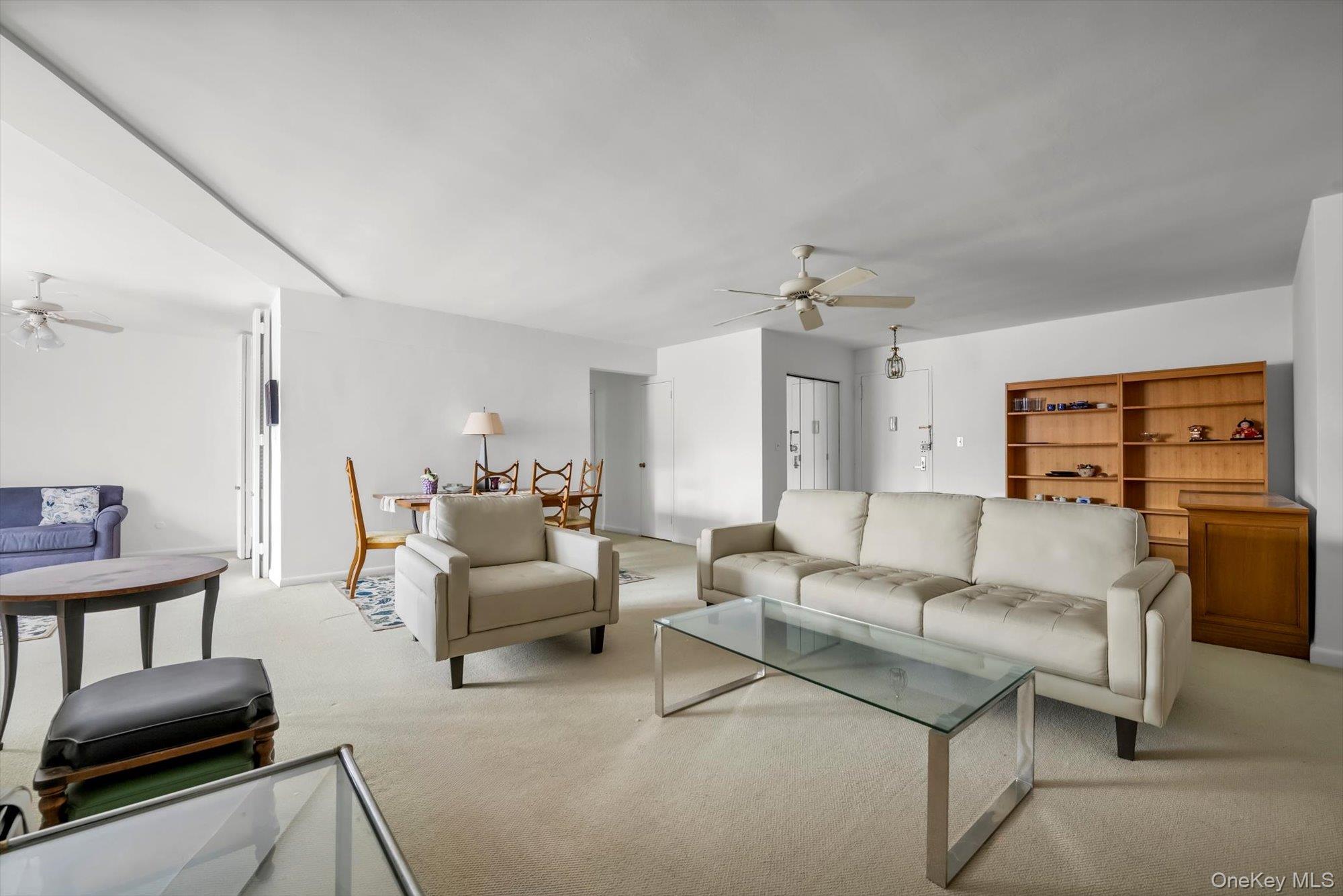 25 Chapel Place, Unit 3N Great Neck, NY 11021 - Photo 6 of 23 a living room with furniture and wooden floor