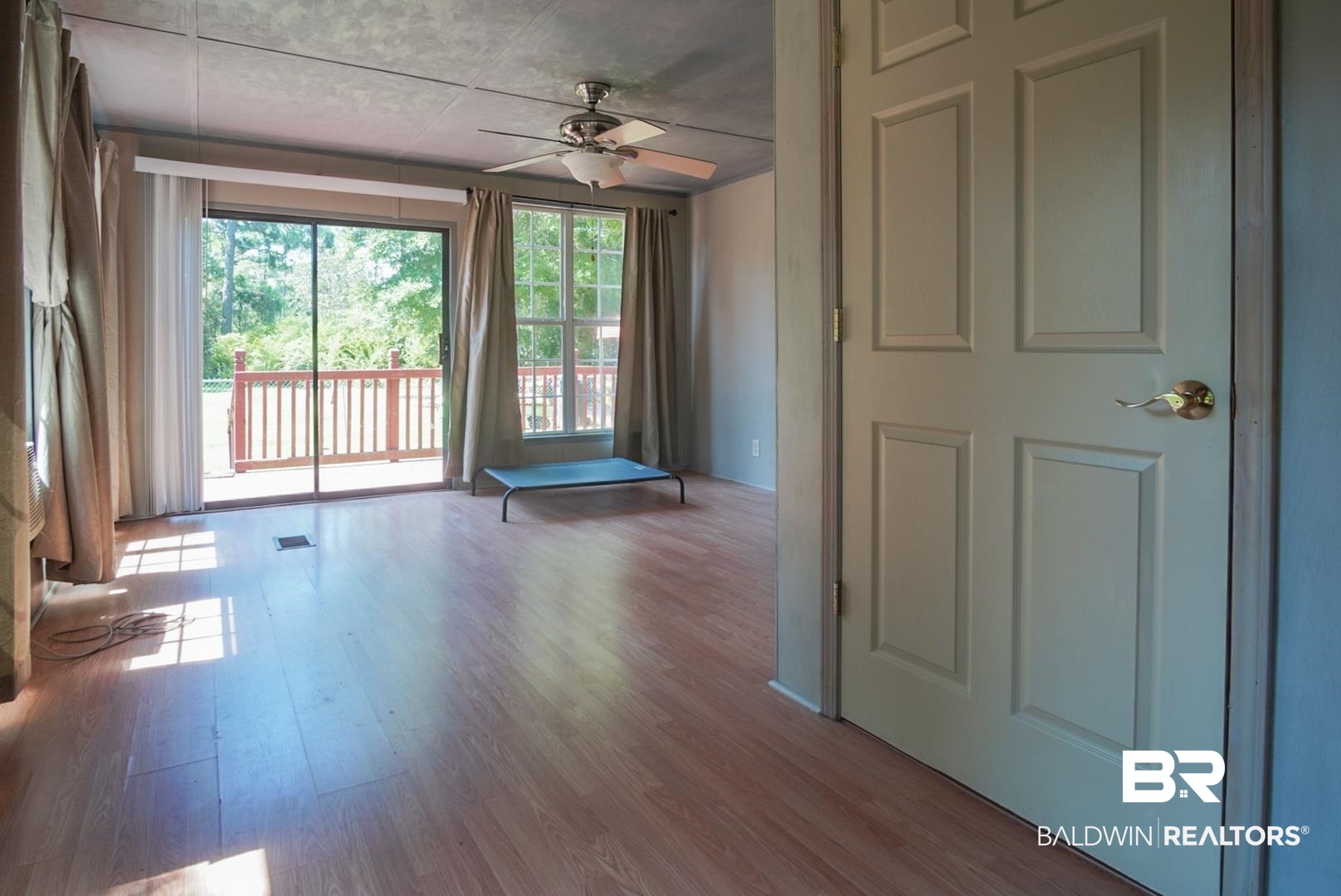 9190 County Road 97 Elberta, AL 36530 - Photo 14 of 53 Unfurnished room with hardwood / wood-style flooring and ceiling fan