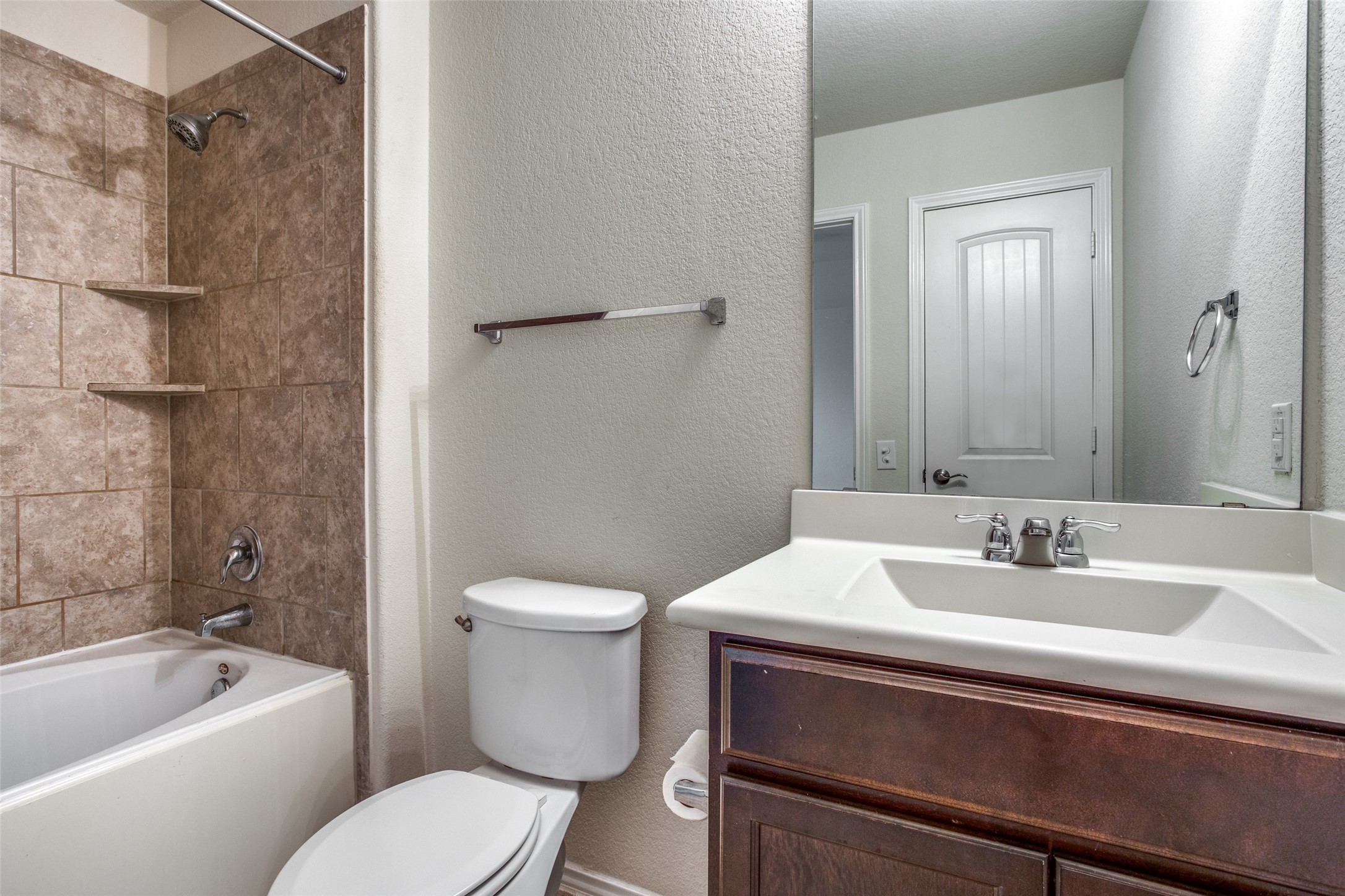 3605 Alpine Autumn Drive Austin, TX 78744 - Photo 16 of 25 a bathroom with a sink toilet and shower