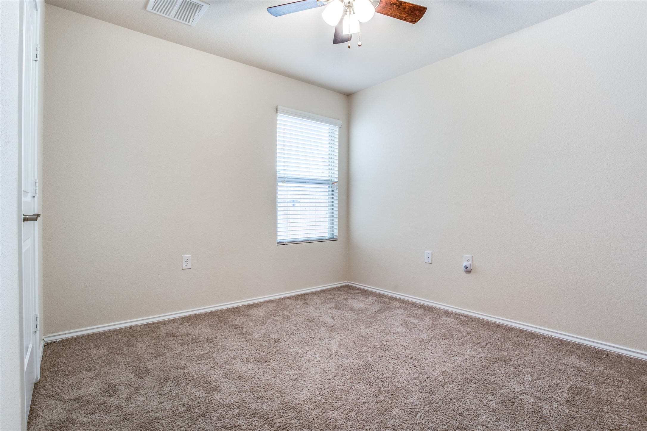 3605 Alpine Autumn Drive Austin, TX 78744 - Photo 21 of 25 an empty room with a window