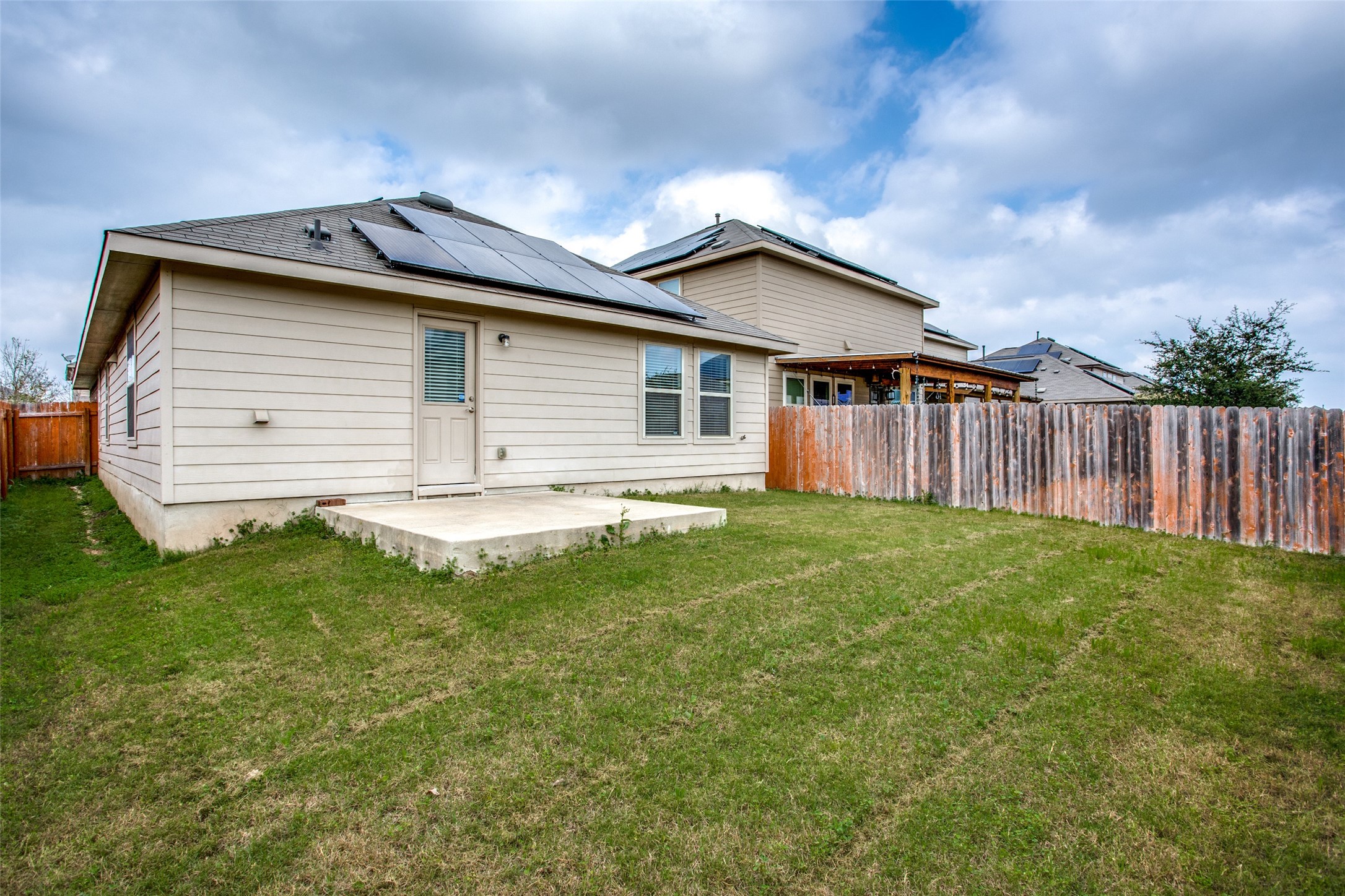 3605 Alpine Autumn Drive Austin, TX 78744 - Photo 24 of 25 a view of a house with a backyard