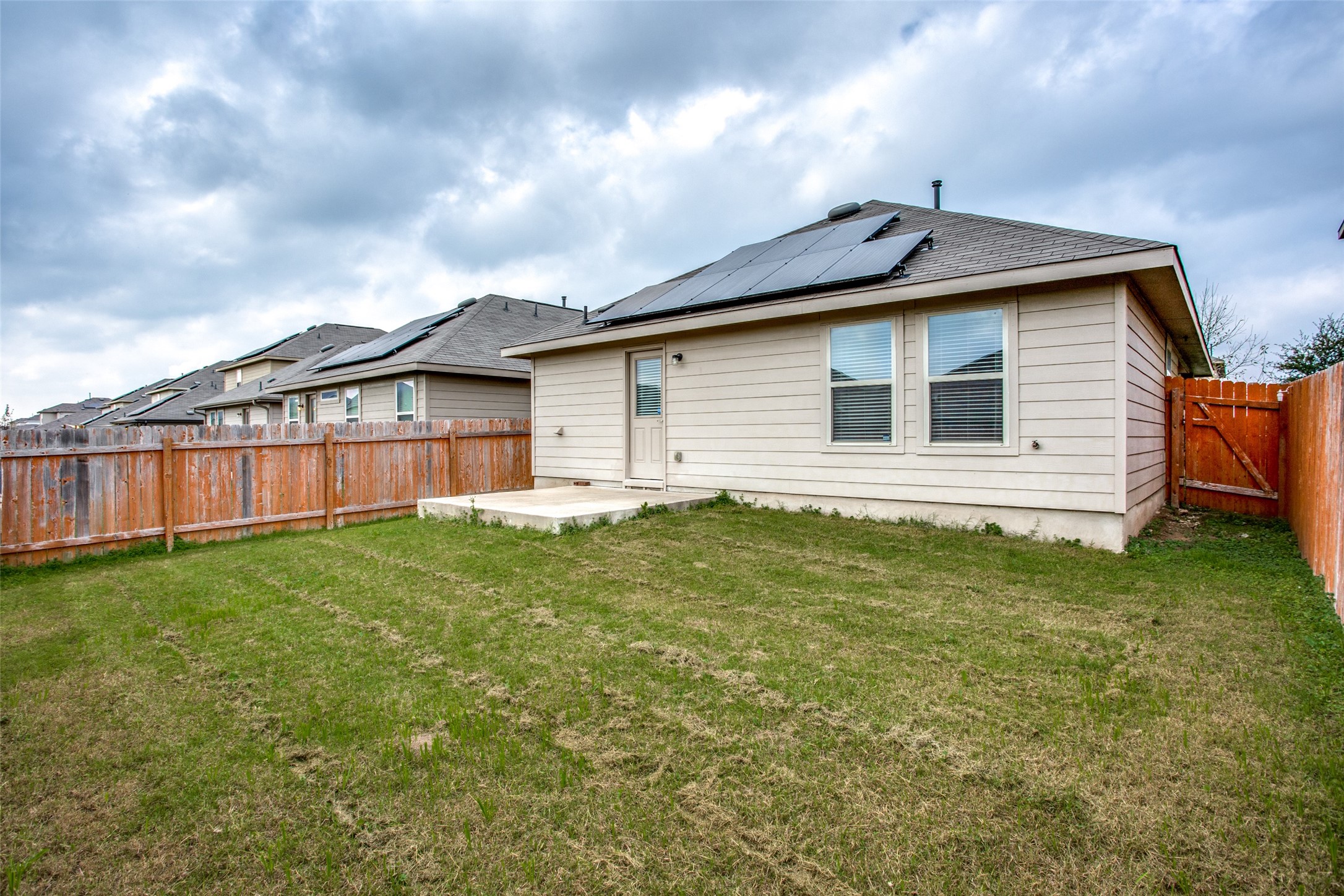 3605 Alpine Autumn Drive Austin, TX 78744 - Photo 25 of 25 a view of a house with a backyard