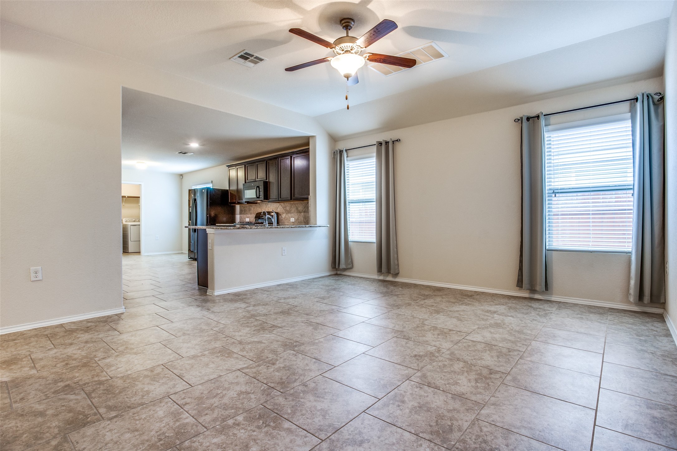 3605 Alpine Autumn Drive Austin, TX 78744 - Photo 4 of 25 a view of a kitchen with a stove and a kitchen view