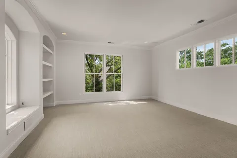 a bathroom with a glass door shower and a sink