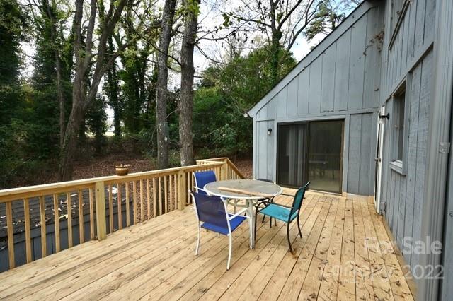 4164 Koala Circle Tega Cay, SC 29708 - Photo 15 of 23 a roof deck with table and chairs and wooden floor