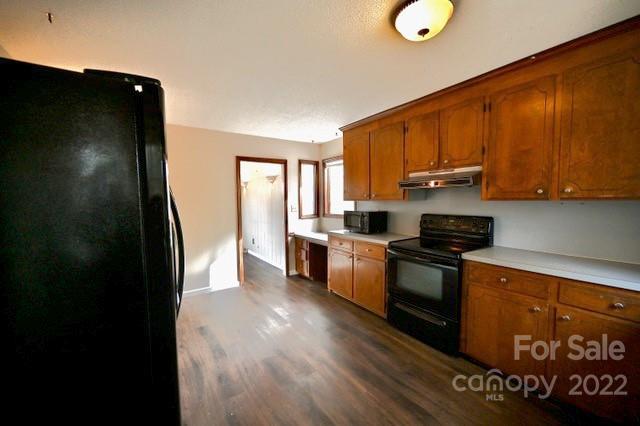 4164 Koala Circle Tega Cay, SC 29708 - Photo 7 of 23 a kitchen with stainless steel appliances granite countertop a stove a sink and a refrigerator