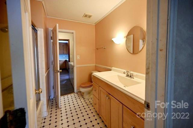 4164 Koala Circle Tega Cay, SC 29708 - Photo 10 of 23 a bathroom with a sink a toilet a mirror and shower