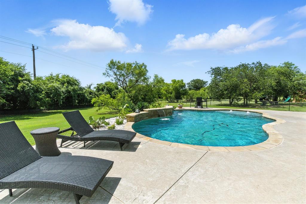 363 Red Bird Drive Springtown, TX 76082 - Photo 12 of 40 a view of a swimming pool and outdoor space