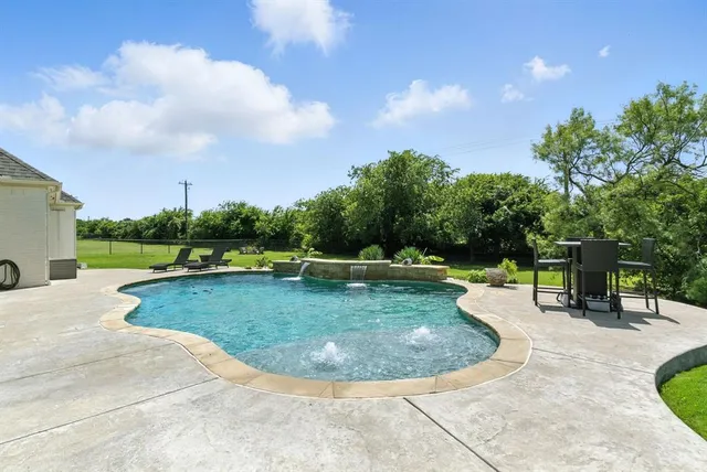 a view of a swimming pool with a sitting space