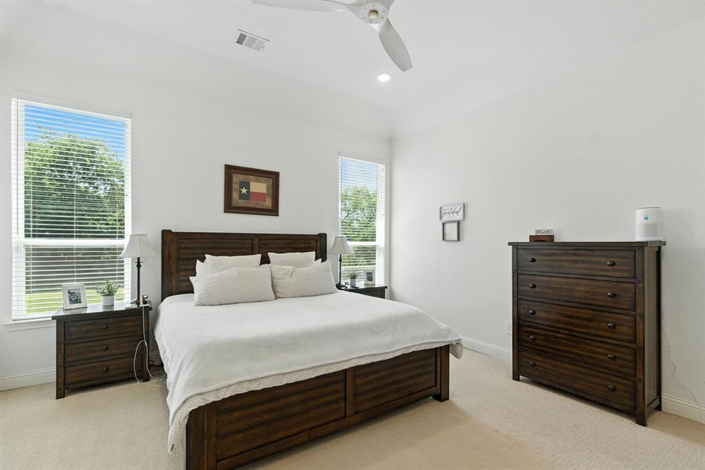 363 Red Bird Drive Springtown, TX 76082 - Photo 20 of 40 a bedroom with a bed and a dresser