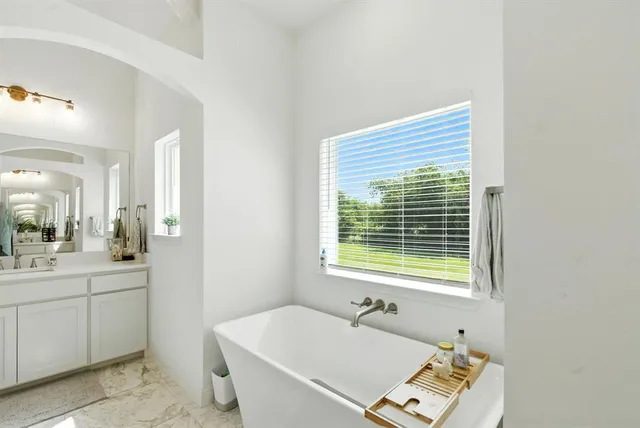 a bathroom with a sink and a bathtub
