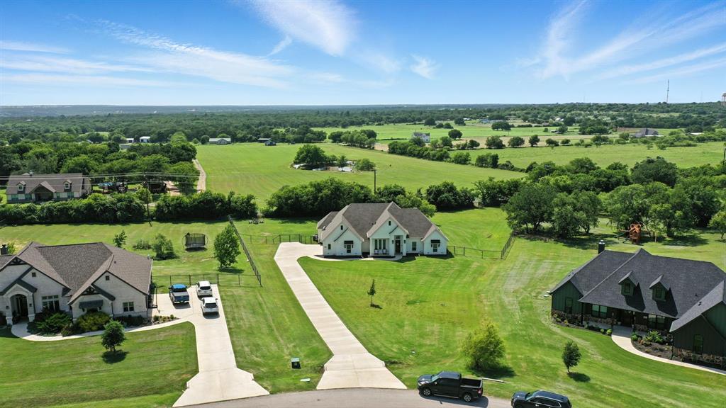 363 Red Bird Drive Springtown, TX 76082 - Photo 3 of 40 an aerial view of a house with outdoor space