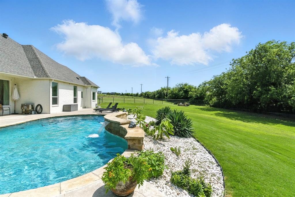 363 Red Bird Drive Springtown, TX 76082 - Photo 8 of 40 a view of a house with backyard and a sitting area