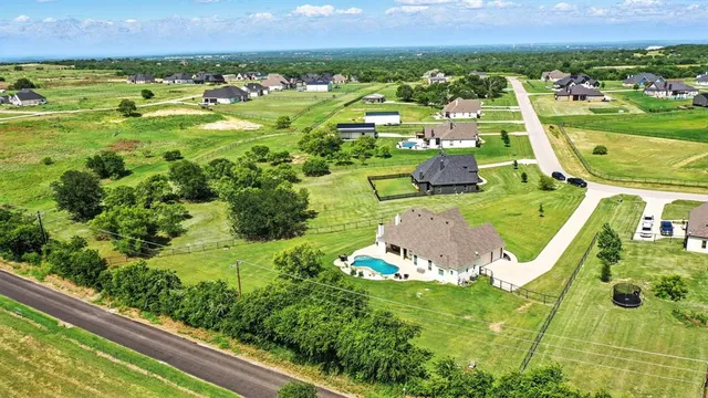a view of a garden with an outdoor seating