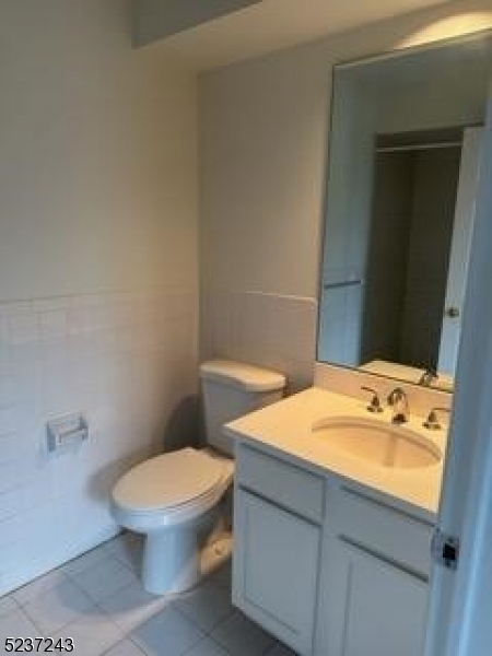 2 Magnolia Court, Unit 2A Madison, NJ 07940 - Photo 12 of 16 a bathroom with a sink a toilet and shower