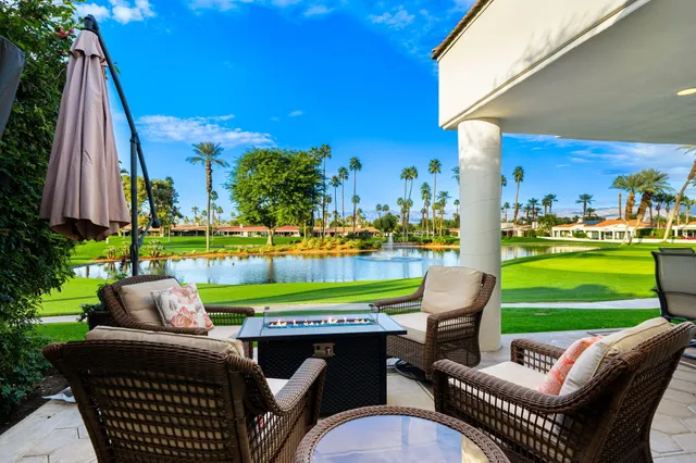 a couple of chairs sitting in front of a building