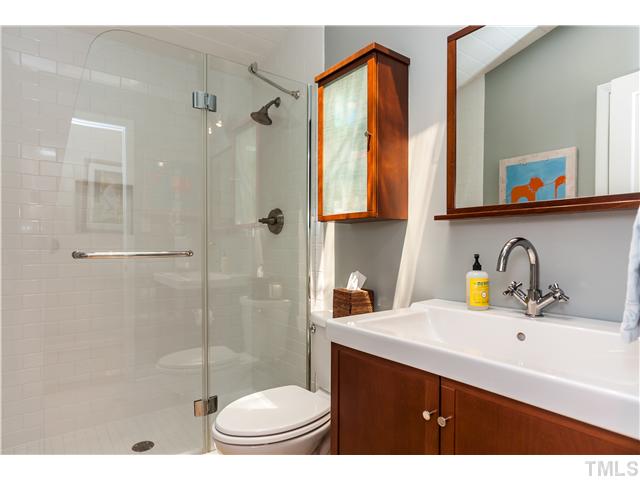 1732 Brooks Avenue Raleigh, NC 27607 - Photo 15 of 24 a bathroom with a sink a toilet and shower