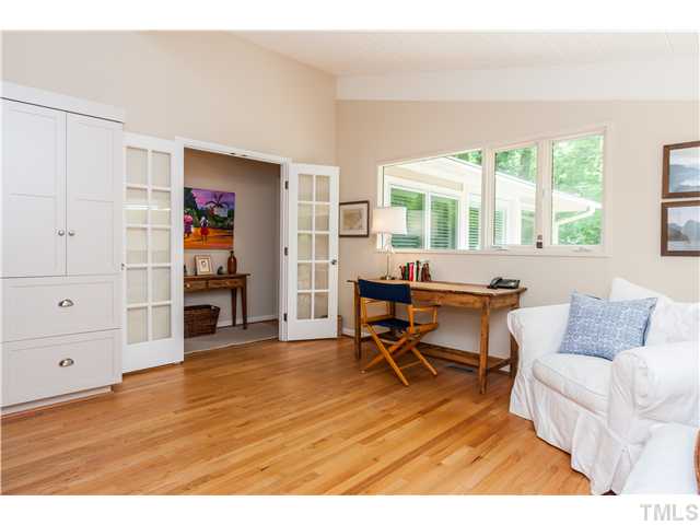 1732 Brooks Avenue Raleigh, NC 27607 - Photo 16 of 24 a living room with furniture and a wooden floor