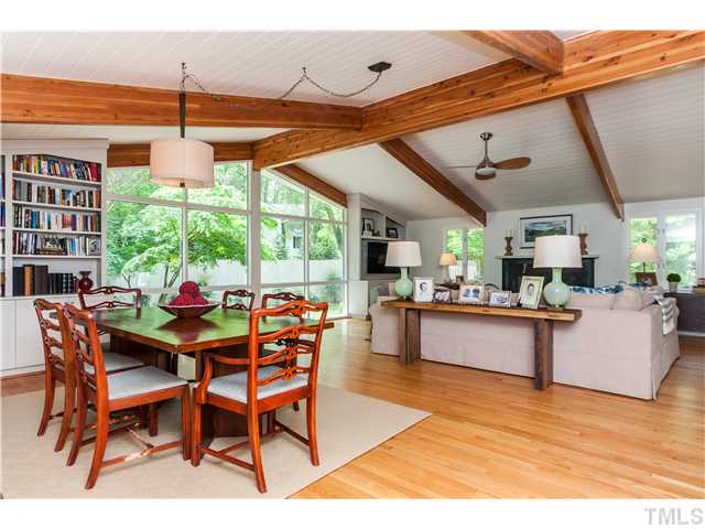 1732 Brooks Avenue Raleigh, NC 27607 - Photo 3 of 24 a dining room with furniture a chandelier and wooden floor
