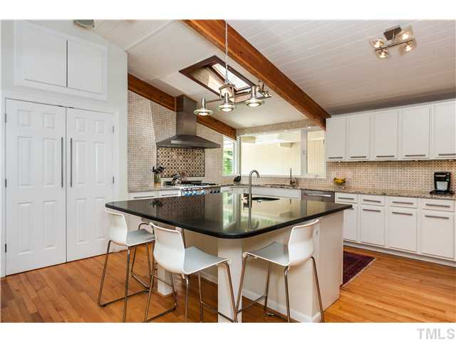 1732 Brooks Avenue Raleigh, NC 27607 - Photo 8 of 24 a kitchen with stainless steel appliances granite countertop a sink and a white cabinets