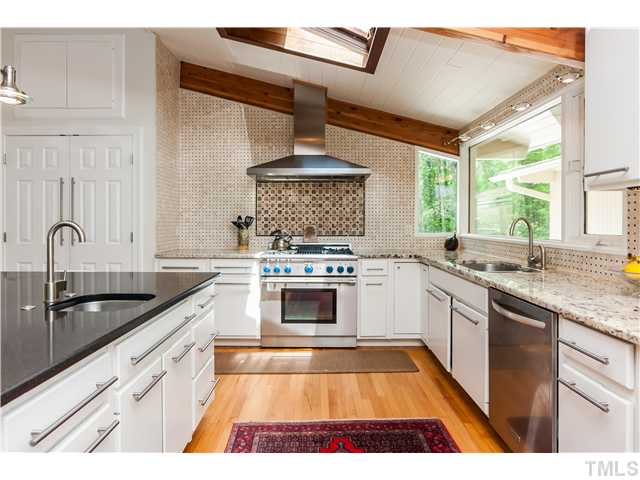 1732 Brooks Avenue Raleigh, NC 27607 - Photo 10 of 24 a kitchen with stainless steel appliances granite countertop a sink stove and cabinets