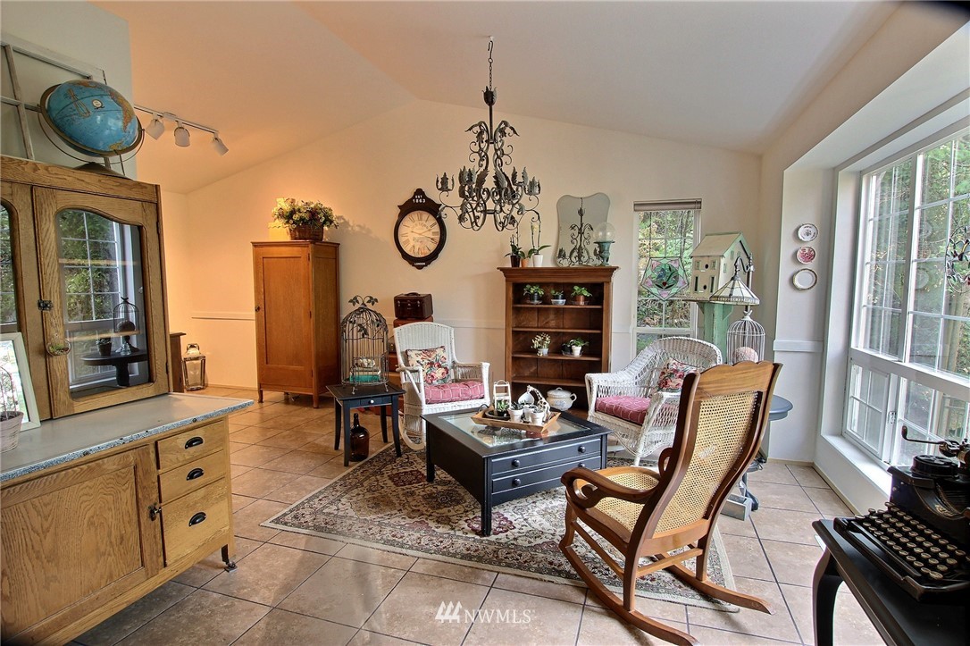 26412 231st Place Southeast Maple Valley, WA 98038 - Photo 2 of 18 a living room with furniture a rug and a window