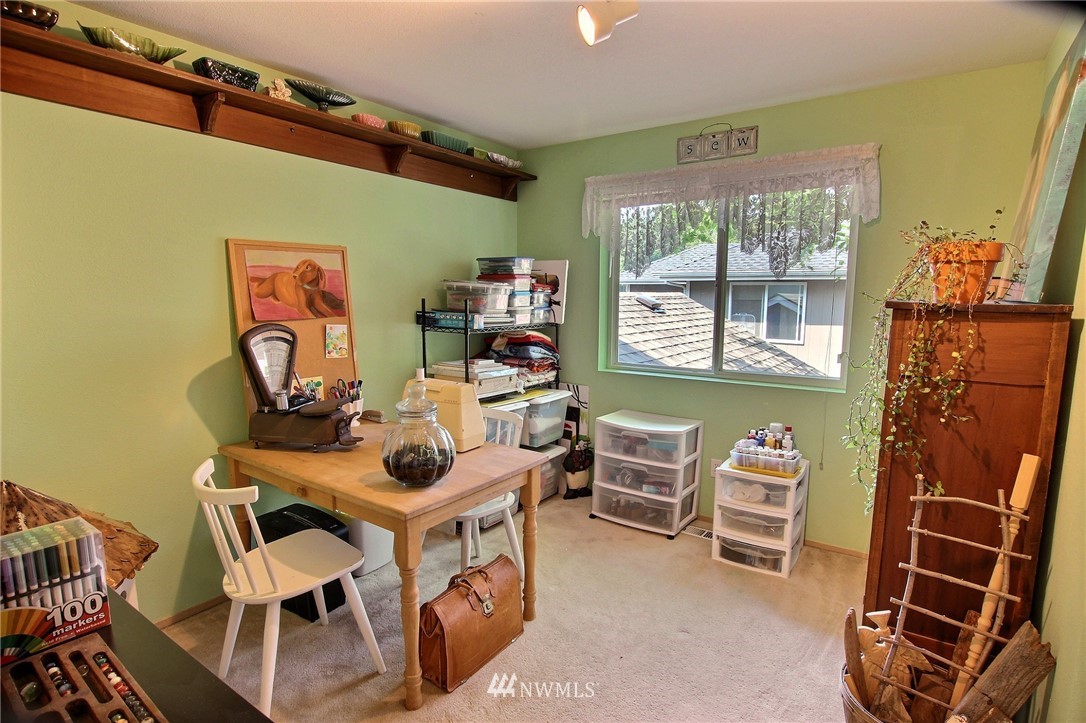 26412 231st Place Southeast Maple Valley, WA 98038 - Photo 13 of 18 a view of a dining room with furniture a rug and wooden floor