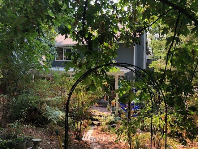 26412 231st Place Southeast Maple Valley, WA 98038 - Photo 17 of 18 a view of a house with a tree