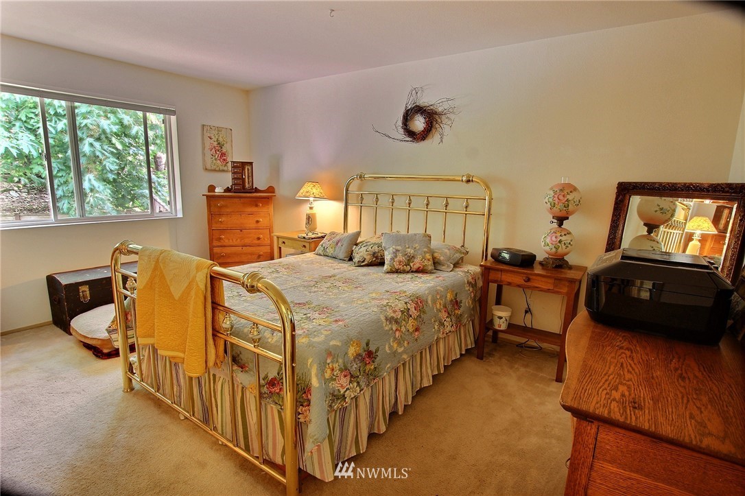 26412 231st Place Southeast Maple Valley, WA 98038 - Photo 9 of 18 a bed room with a bed and a tv
