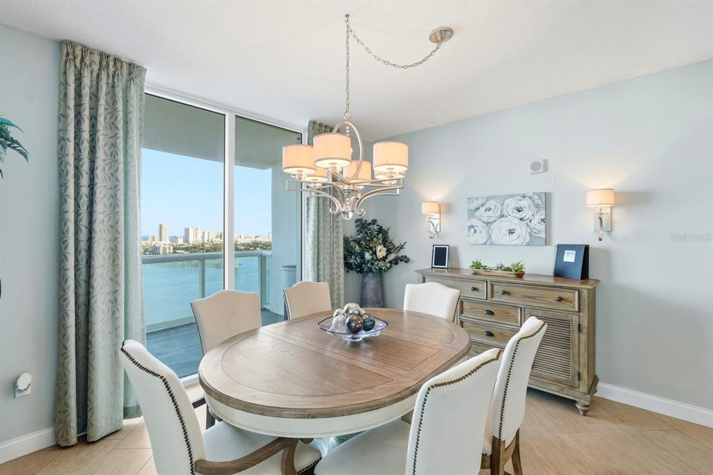 231 Riverside Drive, Unit 1702 Holly Hill, FL 32117 - Photo 15 of 74 a view of a dining room with furniture window and wooden floor