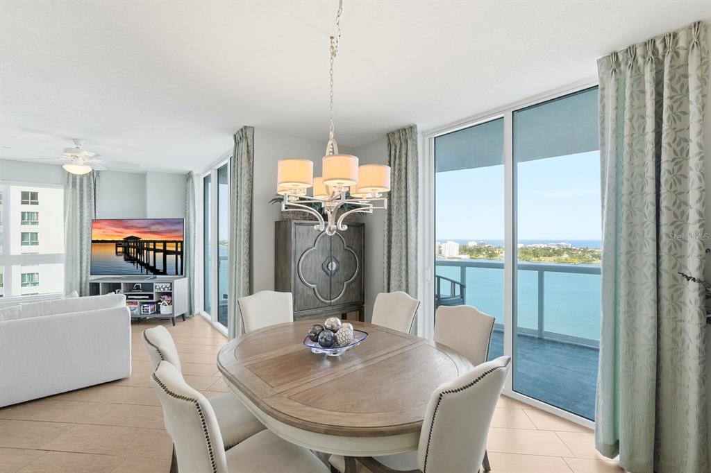 231 Riverside Drive, Unit 1702 Holly Hill, FL 32117 - Photo 16 of 74 a view of a dining room with furniture window and outside view
