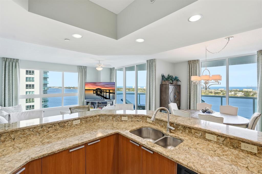 231 Riverside Drive, Unit 1702 Holly Hill, FL 32117 - Photo 22 of 74 a kitchen with stainless steel appliances granite countertop a sink and a counter top space