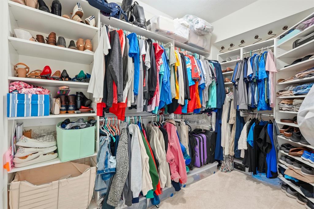 231 Riverside Drive, Unit 1702 Holly Hill, FL 32117 - Photo 28 of 74 a view of walk in closet with clothes and shoes